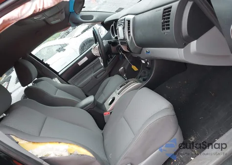 2015 Toyota Tacoma Base V6 z USA, uszkodzony, nr VIN 3TMLU4EN2FM180066